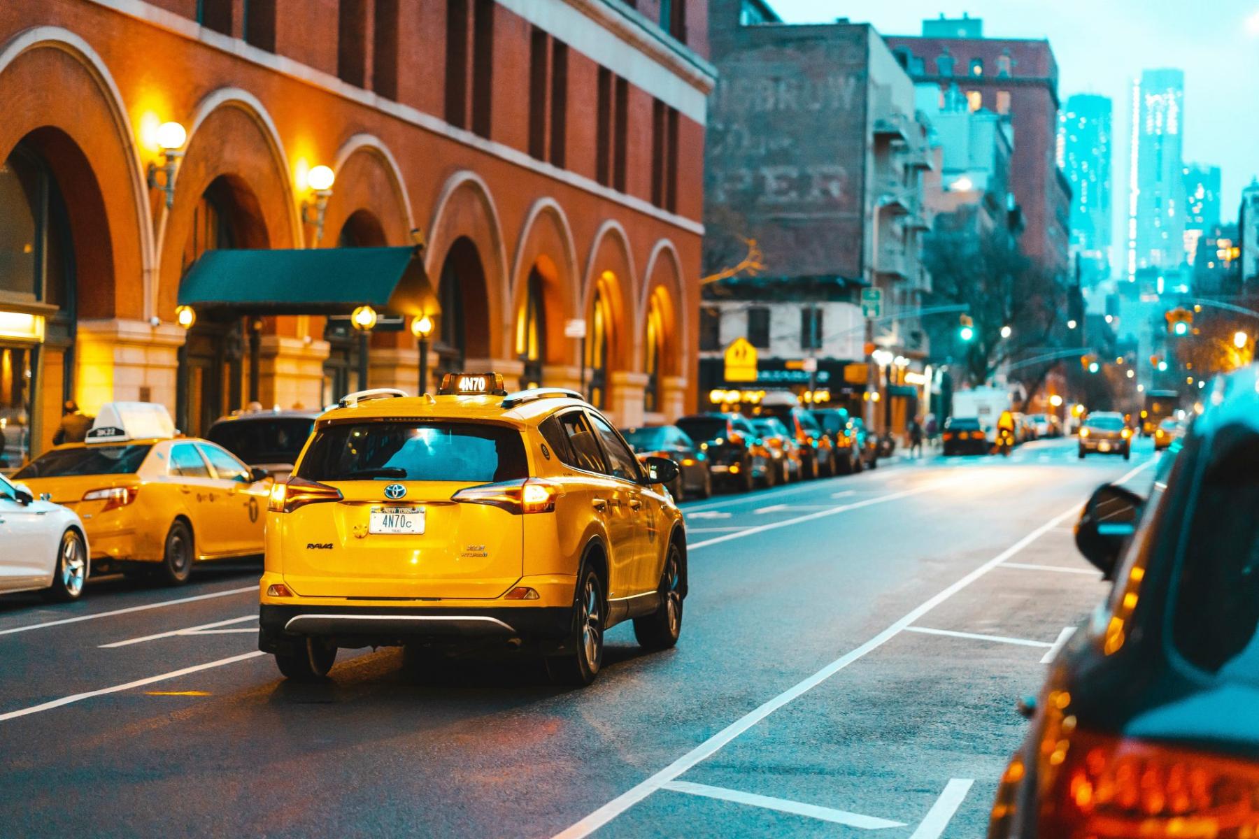 yellow taxi cab on a street