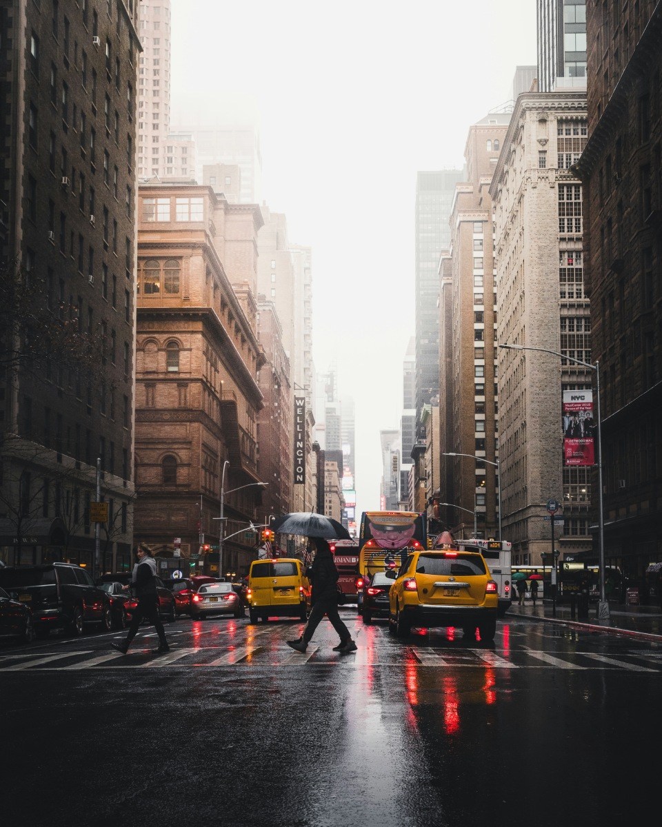 Yellow taxis parked on street

